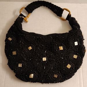 The Sak Black Crochet Shoulder Bag with Gold Accents